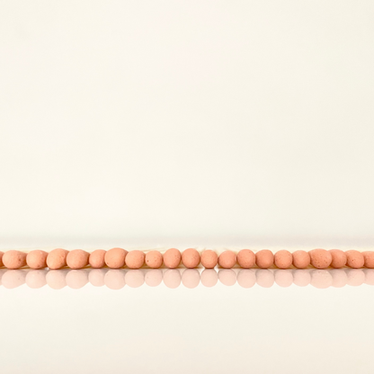 4.8 cm orange matches on a white surface. 