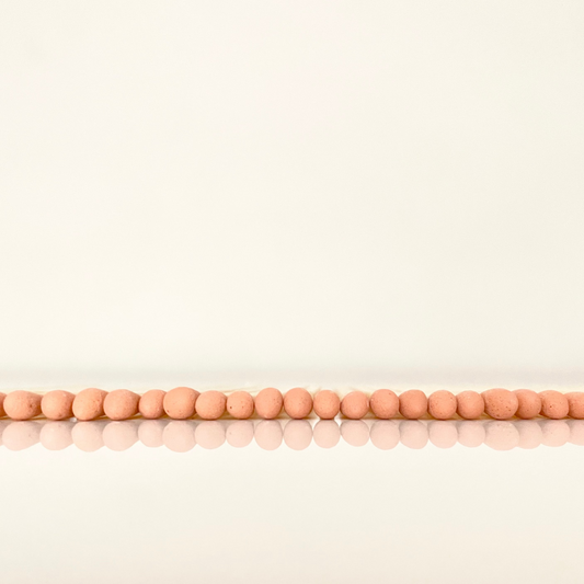 4.8 cm orange matches on a white surface. 