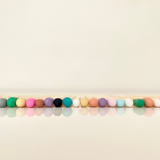 7.5 cm coloured tipped matches on a white surface. 