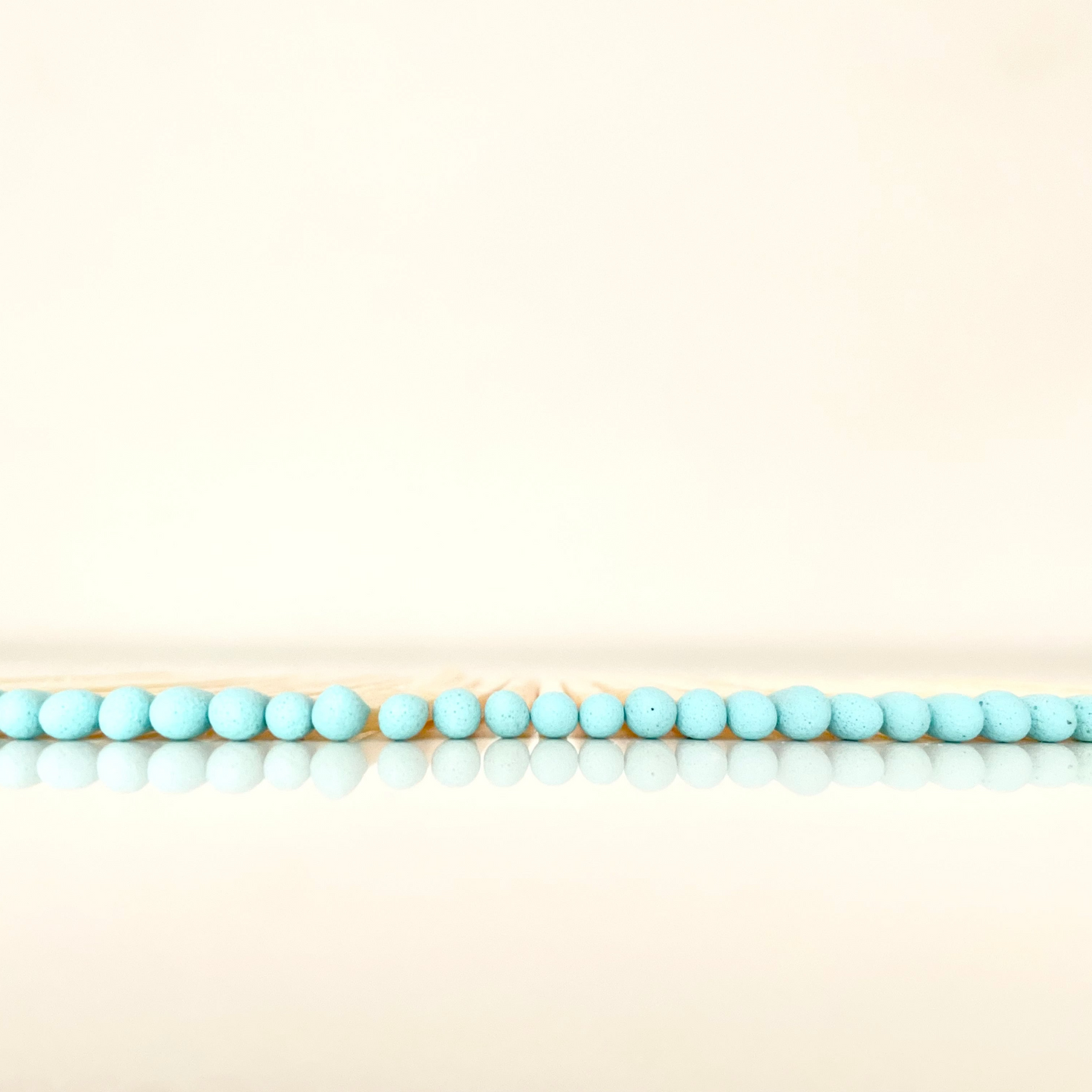 4.8 cm aqua matches on a white surface. 