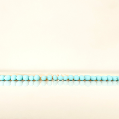 4.8 cm aqua matches on a white surface. 