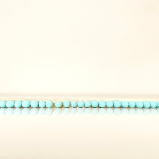 4.8 cm aqua matches on a white surface. 