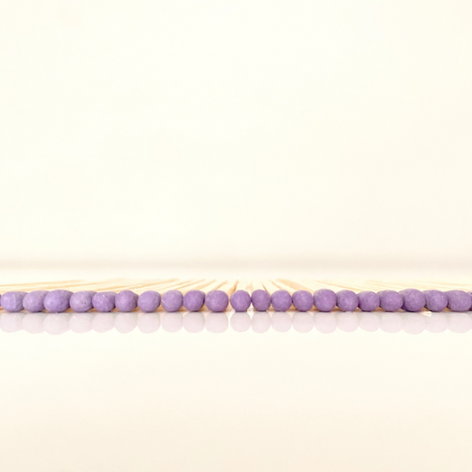 7.5 cm purple matches on a white surface. 