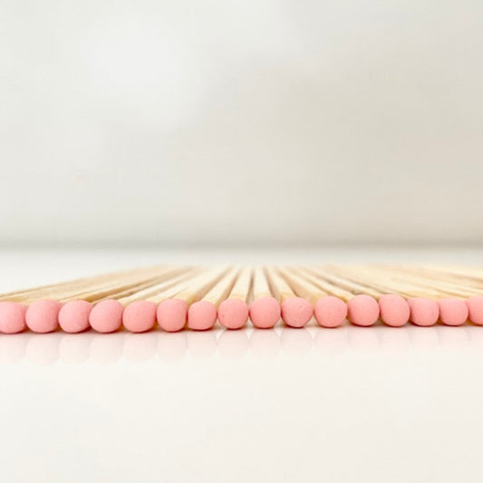 9.8 cm salmon matches on white surface.