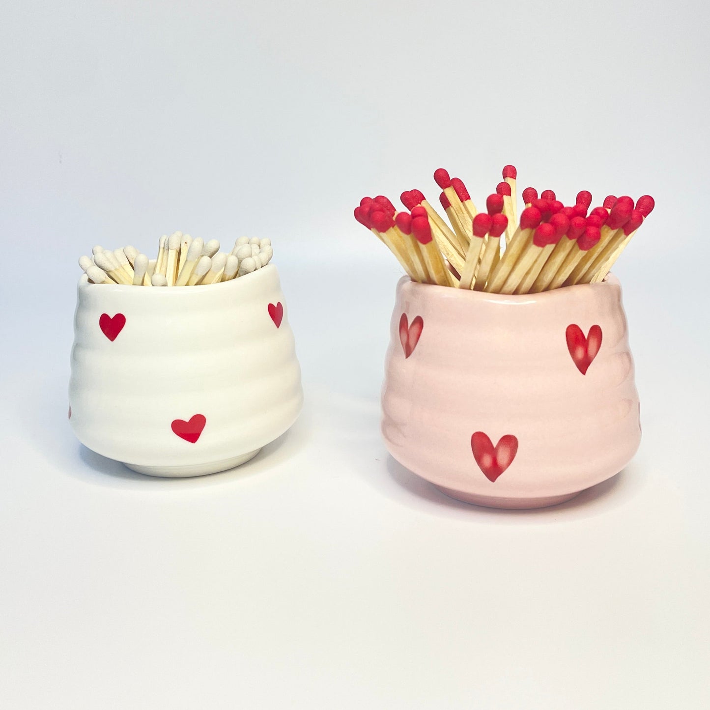 Pink & White match holders with red and white coloured safety matches.