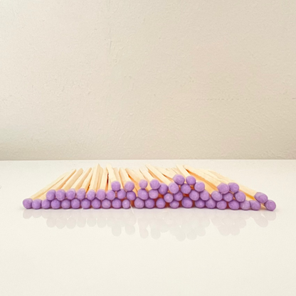 4.8 cm purple matches on a white surface. 