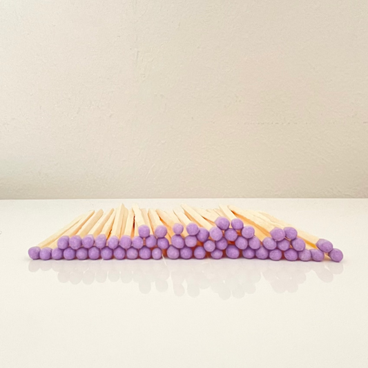 4.8 cm purple matches on a white surface. 