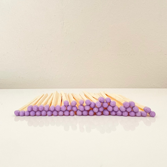 7.5 cm purple matches on a white surface. 