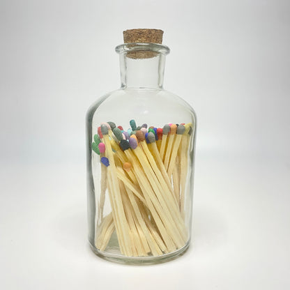 Apothecary match bottle filled with 7.5 cm rainbow matches. 