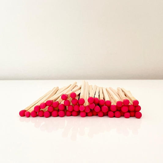 9.8 cm red matches on surface.