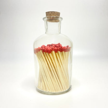 Apothecary match bottle filled with 7.5 cm red matches. 