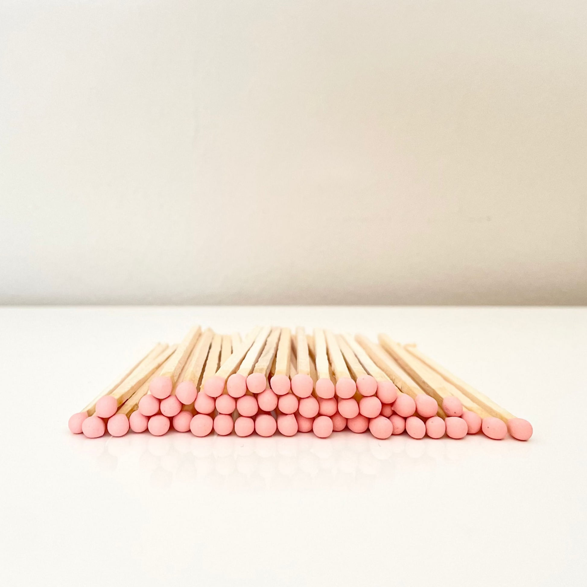 9.8 cm salmon matches on surface.