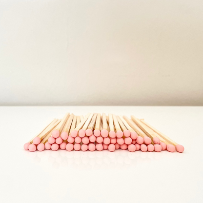 9.8 cm salmon matches on surface.