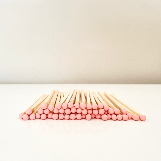 9.8 cm salmon matches on surface.