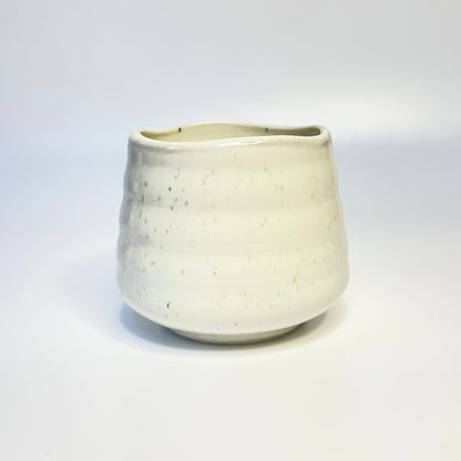 white sprinkled match holder/coffee cup.