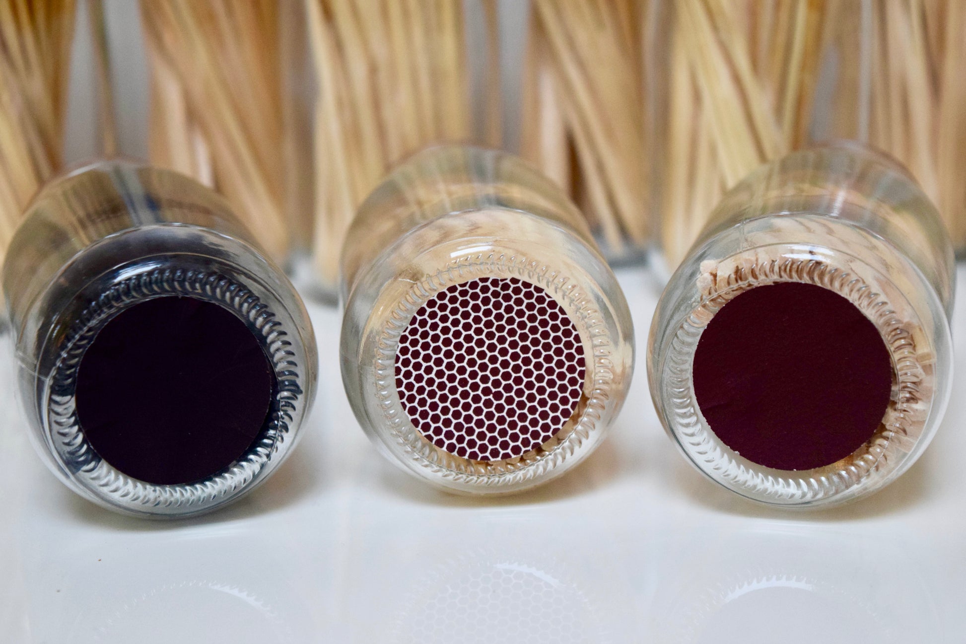 Self-adhesive match striker pads in black, honeycomb and brown on glass match bottles, 1.5 inch (3.8 cm), part of a set of 12, 24, or 50.

