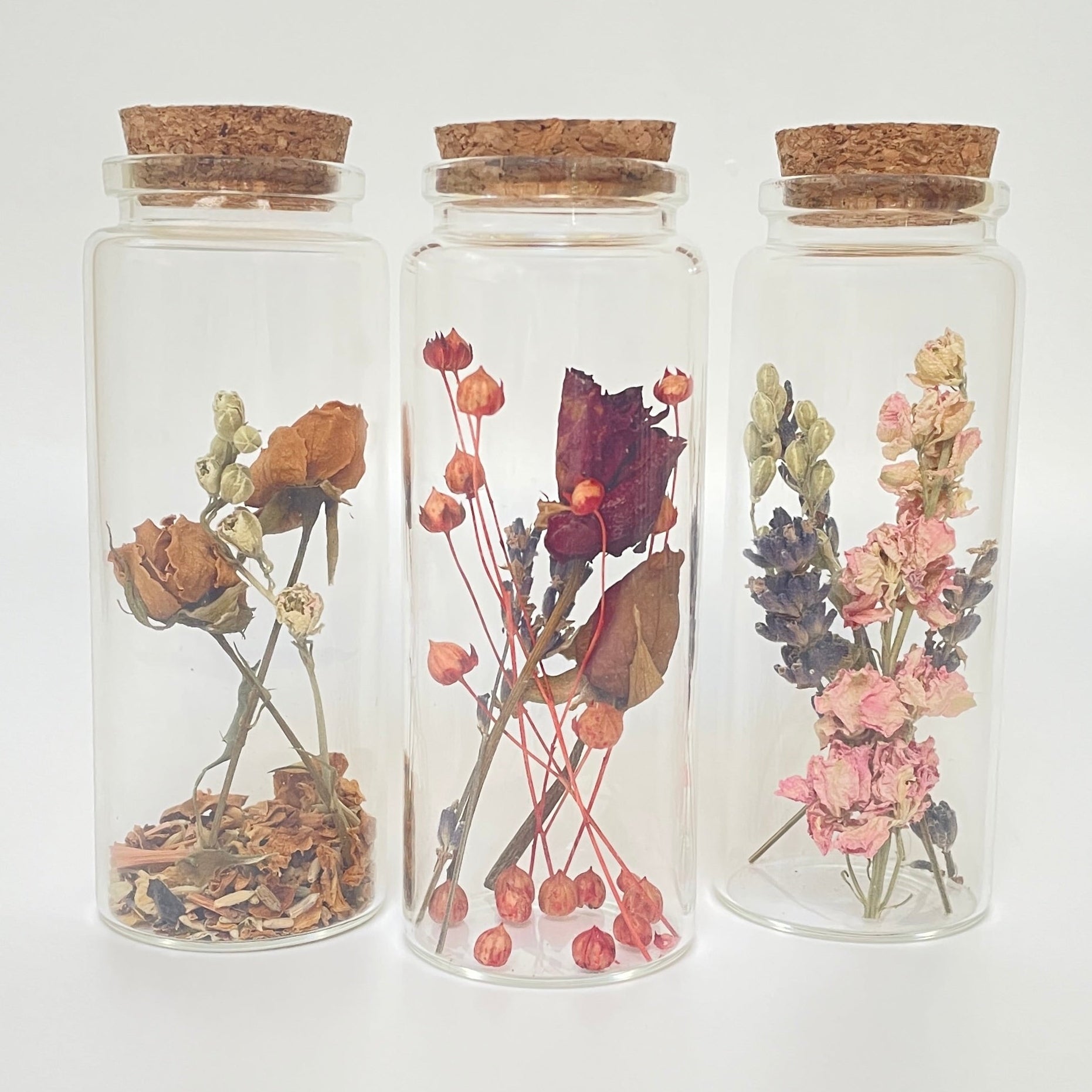 Test tube bottles filled with dried flowers.