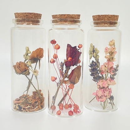 Test tube bottles filled with dried flowers.