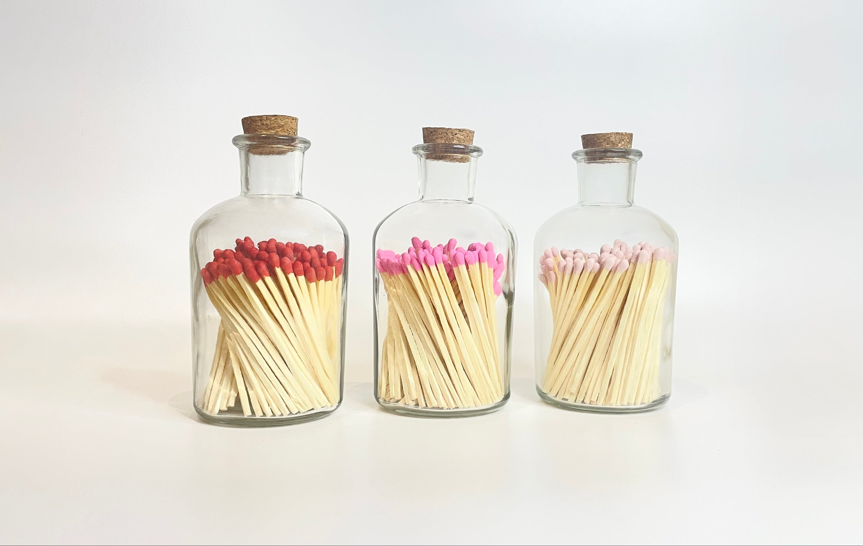 Apothecary match bottles with cork lids filled with 7.5 cm refill matches.