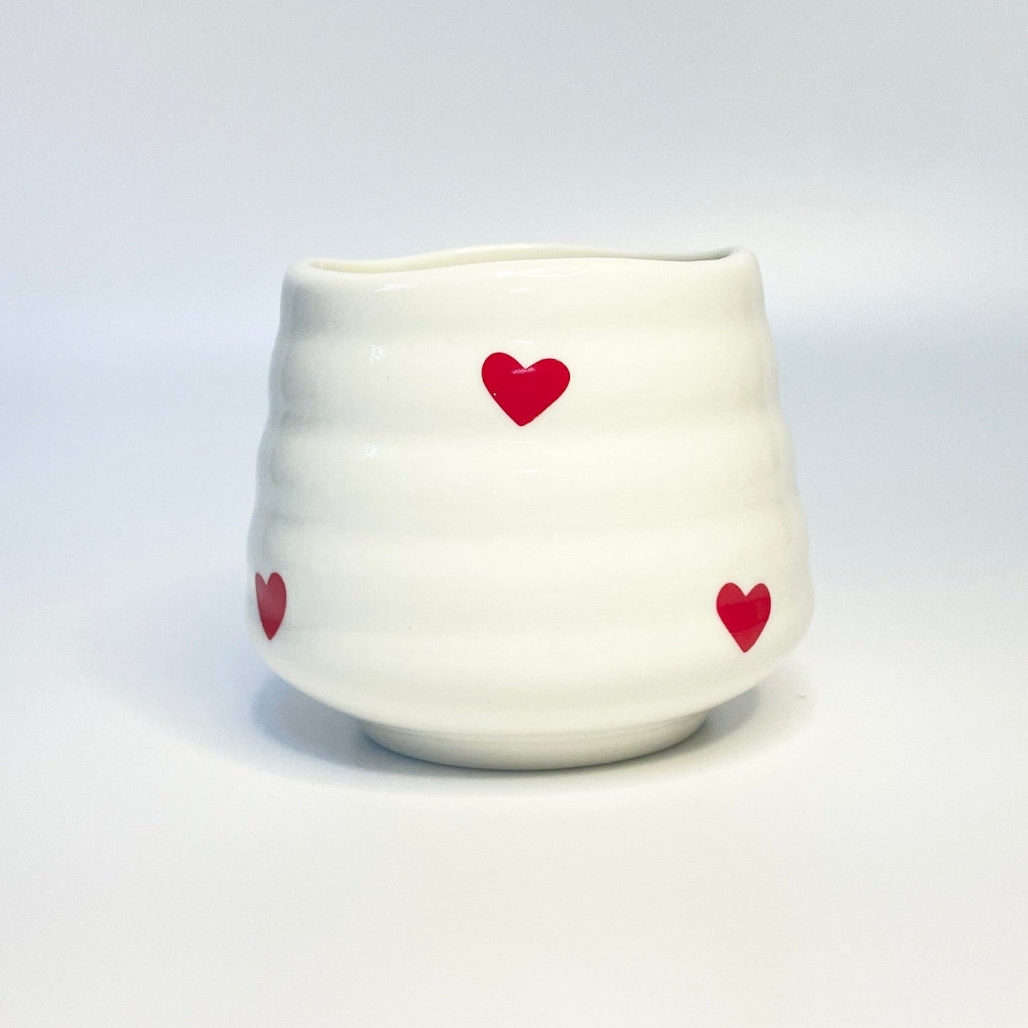 white match holder with red hearts