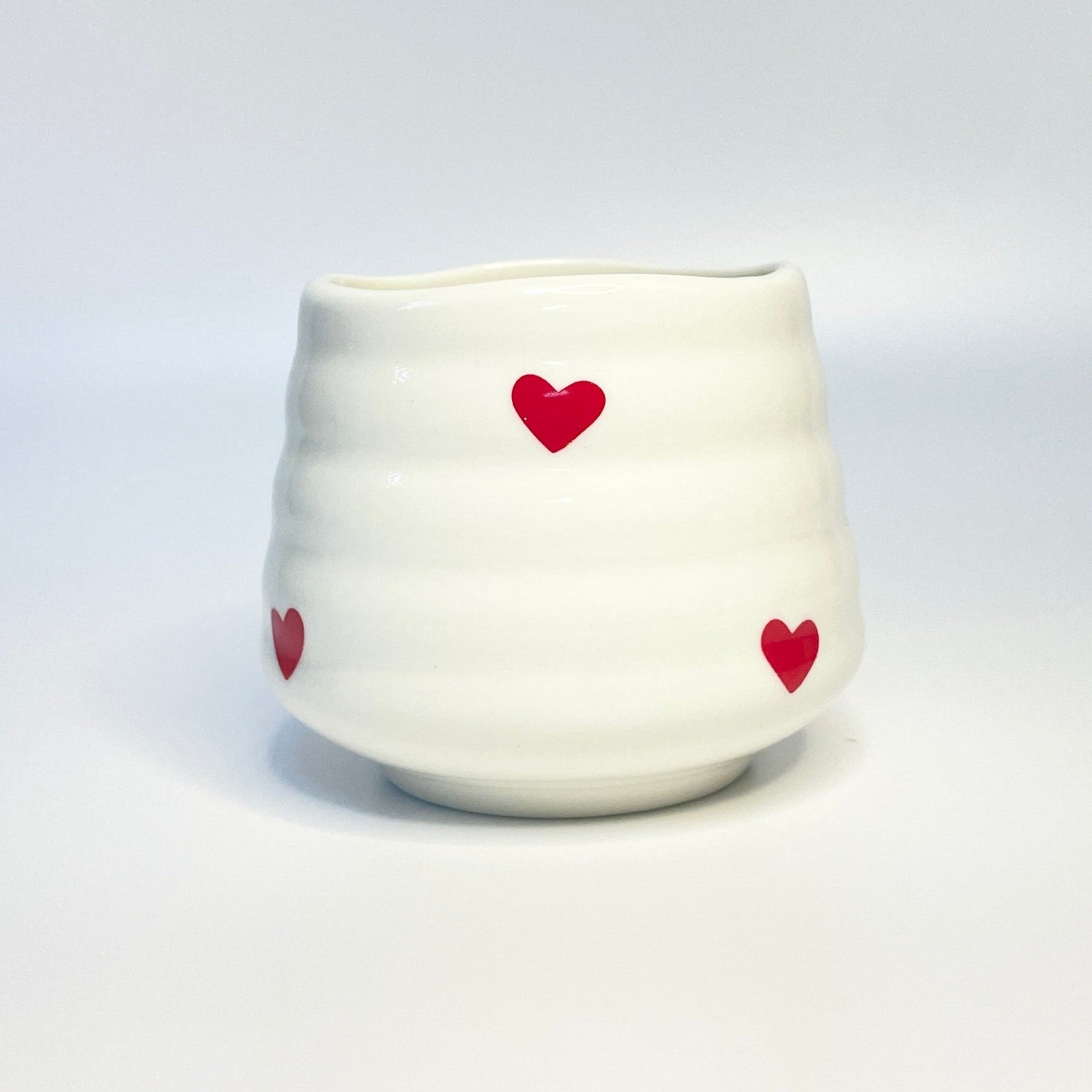 white match holder with red hearts