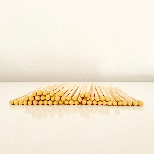7.5 cm yellow matches on a white surface. 